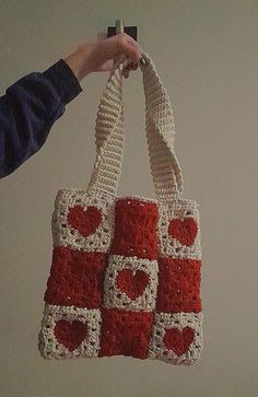 a crocheted bag hanging from a hook