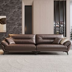 a modern living room with brown leather furniture