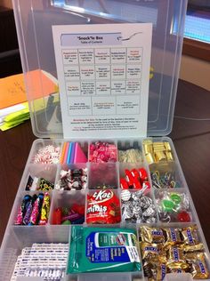 a clear plastic box filled with lots of candy