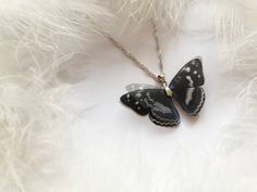 Midnight Black Pendant with Silk Butterfly Wings! :)Do you remember the first time when a butterfly sat on you? :) If not you must feel it in your free time in some butterfly garden! :) It inspired me when I was making this butterfly It will add to your look a touch of nature, the butterfly will flutter on you as it's a real one :)The butterfly is made manually of natural silk. Using multiple levels gives an unusual flickering 3D effect.Due to properties of natural silk wings are light and trans Elegant Black Butterfly Charm Necklace, Elegant Black Necklace With Butterfly Charm, Elegant Black Butterfly Necklace Gift, Black Butterfly-shaped Jewelry For Gift, Black Butterfly Jewelry For Gift, Black Butterfly Charm Jewelry, Wing-shaped Black Jewelry Gift, Black Wing-shaped Jewelry Gift, Wing-shaped Black Jewelry For Gifts