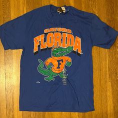 Nutmeg Mill Label. New With Tag, In Perfect Condition. From Approximately 1995. 90s Blue T-shirt For College, 90s Style Blue T-shirt For College, Florida Gators, Vintage Florida, Blue Orange, Blue Man, Vintage Outfits, Florida, Tee Shirts