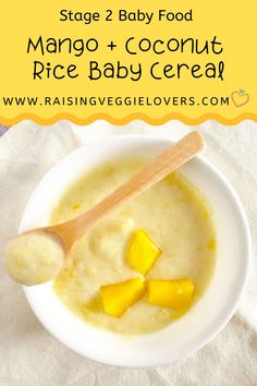 a bowl of mango and coconut rice baby cereal with a wooden spoon in the bowl