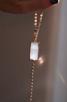 This gorgeous lariat necklace is the perfect statement piece you can wear to call in all the highest energy into your life! Selenite is a gemstone that has the highest frequency energy as well as charges everything around it with good energy. The gold coin chain sparkles. 1" x .5" x .25" Selenite gemstone pendant 14k gold fill or gold plated disc chain Length of lariat tail is 3" Handmade in Arizona Model is wearing 18" in photos. Please use the size guide below to confirm your length. Contact u White Spiritual Lariat Necklace, Spiritual White Lariat Necklace, White Long Drop Lariat Necklace As Gift, White Long Lariat Necklace As Gift, White Lariat Necklace With Pendant And Adjustable Chain, White Lariat Necklace With Adjustable Pendant Chain, Highest Frequency, Gold Coin, Mala Necklace