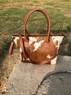 Welcome to our exclusive collection of handcrafted items, where authenticity meets creativity! We present to you our Cowhide Western Purse Tote Bag, a perfect blend of rustic charm and modern elegance. This unique tote bag is made from genuine hair-on cowhide leather, exuding a luxurious yet rugged appeal that's sure to turn heads wherever you go. Our Cowhide Western Purse Tote Bag measures 15x13x5 inches, providing ample space for all your essentials. This bag is not only stylish, but also prac Exotic Hair, Large Tote Purse, Cowhide Purse, Western Handbags, Cowhide Handbags, Cowgirl Gifts, Unique Tote Bag, Fur Purse, Leather Tote Bag Women