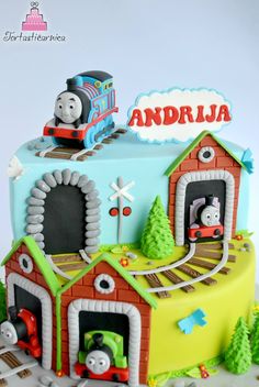 a thomas the train birthday cake is on display