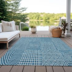 a blue area rug on a wooden deck