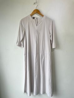 Pietsie Light Grey Cotton Dress. Super cozy dress that can be layered! A bit sheer, and has pockets. A great layer base, or can be worn as-is. Marked size S. 100% cotton. Approx. Measurements: Length: 48" Underarm to underarm: 19" Sleeves: 15" Cotton Dresses For Spring Layering, Casual White Dresses For Layering, Cotton Tunic Dress For Workwear, Modest Cotton Midi Dress For Daywear, Cotton Midi Dress With Pockets For Daywear, Spring Layering Dresses With Relaxed Fit, Cotton Midi Dress With Slip Pockets For Daywear, Cotton Tunic Midi Dress For Daywear, Spring Layering Relaxed Fit Dress