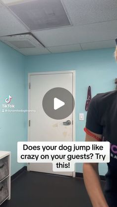 a woman standing in front of a blue wall wearing a t - shirt that says does your dog jump like crazy on your guests? try this