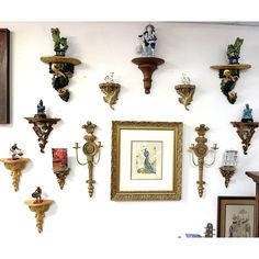 the wall is covered with many different types of sconces