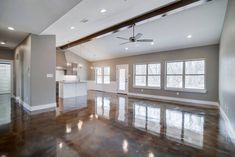 an empty kitchen and living room in a new construction home that is being built on the same lot