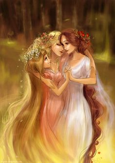 two beautiful women hugging each other in the woods with flowers on their heads and long hair