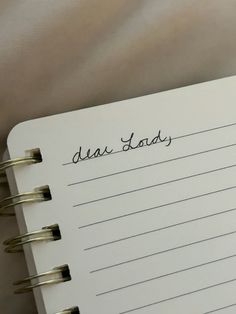 a notepad with writing on it that says diaa doss written in cursive ink