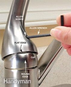 a person is opening the handle on a kitchen faucet with instructions to fix it