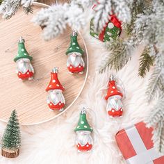 christmas ornaments are displayed on a table