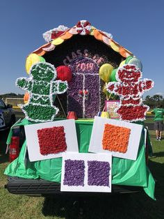 a car decorated with flowers and decorations on the back