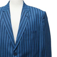 This Chiragh Apparel blazer is an elegant upgrade on dapper tailoring and features rich shades in a sumptuous fabric for elegant opulence. Fashioned from premium quality wool, this striped blazer features full lining in Japanese silk, a notch lapel, two-button closure and single-vented back. A left chest pocket and three flap pockets appoint the front while the inside has two (2) pockets on the left and one (1) pocket on the right. A flash of contrast piping is added to the jacket lining inside. Elegant Blue Blazer For Wedding, Blue Tuxedo Blazer For Work, Tailored Blue Blazer For Wedding, Blue Tailored Blazer For Wedding, Bespoke Blue Suits For Formal Occasions, Bespoke Semi-formal Blazer With Hidden Button Closure, Bespoke Blazer With Hidden Button Closure For Semi-formal Occasions, Elegant Blue Blazer With Notch Lapel, Elegant Blue Outerwear For Wedding