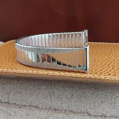 NOS 1960s old-stock Speidel Depth 10K white gold-filled expansion watch bracelet. The are straight and measure 3/4" (18.8mm), you can file them to 11/16" (17mm-18mm).   Spring bars are included, remember to tell us what size you need.  The length at the spring bars is 6" (152mm).  We can shorten it for no extra charge and might have links to add, send a message with length you need before purchase and we'll see if it can be done.  35B.5524 Vintage Silver Watch Band With Stainless Steel Clasp, Vintage Silver Adjustable Watch Bands, Retro Round Silver Watch Accessories, Retro Silver Watch Accessories For Anniversary, Retro Silver Watch Accessories For Formal Occasions, Watch Bracelet, May 31, Vintage Watches, Watch Band