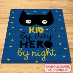 a blue rug with the words kid by day hero by night on it