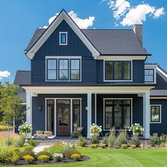 a house with blue siding and white trim