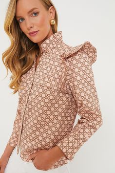 An playful update to the classic button down, the Petal Cane Winnie Blouse is the seasonless style that you will have for years to come. Easily paired with light or dark denim, skirts or shorts, tucked in or out, this top perfectly embodies unfussy femininity without limiting your styling options. In a classic yet eye-catching geometric pattern and ruffle details have us swooning for this full of personality top! Ruffle stand collar Flutter shoulder details Long sleeves Button cuffs Ruffle detai Classic Blouse With 3/4 Sleeves And Button Cuffs, Button-up Blouse With Pintucks For Daywear, Classic Fitted Top With Peter Pan Collar, Fitted Floral Print Top With Peter Pan Collar, Classic Floral Print Button-up Top, Denim Skirts, Dark Denim, Stand Collar, Fabric Material