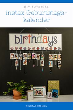 a birthday banner hanging on the wall next to a potted plant and photo frame