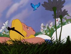 a cartoon character laying in the grass next to flowers and a blue bird flying overhead