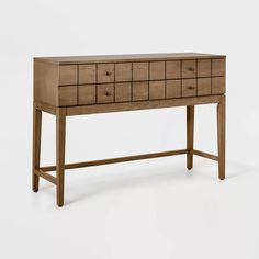 a wooden desk with drawers and legs on it's side, against a white background