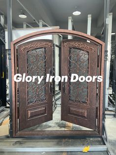 an iron door is shown with the words glory iron doors on it's side