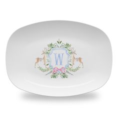 a white plate with the letter w on it