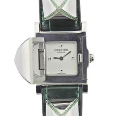 Stainless Steel Hermes Medor Mini Tsavorite Quartz Watch. Watch is in excellent preowned condition. Comes with box. BRAND: Hermes MODEL: Medor Mini REF: ME3.235 CASE SIZE: Case is 23mm. Band is 8 1/4"" long CASE MATERIAL: Stainless Steel FUNCTIONS: Hours, Minutes CONDITION: ﻿Excellent pre owned BOX: Yes PAPERS: No Hermes Model, Diamond Quartz, Stunning Jewellery, Steel Watch, Quartz Watch, Accessories Watches, Things To Sell, Stainless Steel, Band