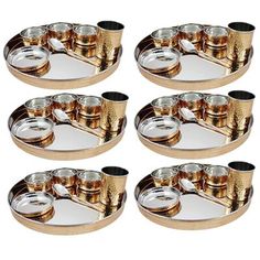 set of six gold plated dishes with black rims