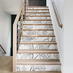 the stairs are decorated with floral wallpaper