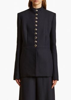 A close-fitting, stand-collar jacket traced by chalk stripes. Lined with trompe l'oeil buttons reprised at the cuffs, the placket conceals internal snaps. Stand Collar Jackets, Abaya Designs, Wool Blend Jacket, Winter Wear, Navy White, Stand Collar, Suits For Women, Fashion Inspo Outfits, Navy And White