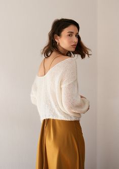 "Delicate hand-knit sweater made from super soft and luxurious kid mohair blend. This pullover has two reversible sides, one deep V-neck side, and one boat neck side so you can wear it either way. Designed to flatter all silhouettes with its loose oversized fit, slightly cropped length and puffy balloon sleeves. Comes in 8 versatile colors, carefully chosen to match all wardrobe color palettes. Handcrafted in Greece. DETAILS * Super soft, premium quality Italian mohair * Composition: 60% kid moh Knit Mohair Sweater, Chunky Knit Headband, Bridal Sweater, Pull Mohair, Knit Turban, Knitwear Inspiration, V Neck Pullover, Hand Knitted Sweaters, Mohair Sweater