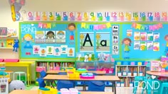 a classroom filled with lots of desks and colorful bookshelves on the wall