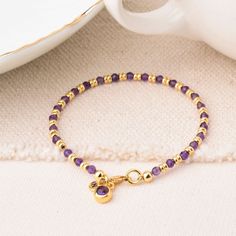 Say hello to the Amethyst Linear Bracelet, a must have for February babies or anyone taken with the beauty of amethyst! This birthstone bracelet is all about that laid back look. Each amethyst gemstone brings that gorgeous purple hue, radiating calming energy and good vibes. Its simple yet stylish design makes it a perfect match for any outfit, whether you're rocking jeans and a tee or dressing up for a night out. Available in eco Sterling Silver or Gold Plated eco Sterling Silver with natural amethyst facet beads and an amethyst charm let your wrist sparkle and shine with this beautiful February birthstone bracelet! Amethyst: emotional stability | intuition | physical health We want your jewellery to stay in great condition so you can enjoy it for years to come. With some simple steps you Spiritual Amethyst Beaded Birthstone Bracelet, Spiritual Purple Birthstone Bracelets, Purple Beaded Birthstone Bracelets As Gift, Purple Beaded Birthstone Bracelets For Gift, Purple Birthstone Beaded Bracelets As Gift, Purple Birthstone Beaded Bracelets For Gift, Purple Amethyst Birthstone Bracelet, Amethyst Birthstone Bracelet For Healing, Elegant Purple Birthstone Beaded Bracelets