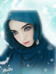 a woman with blue eyes wearing a hijab