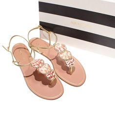 Aquazzura Gold Designer Flat Flip Flops For Beach, Designer T-strap Sandals For Summer Beach, Luxury T-strap Sandals For Summer Beach, Designer Flip Flops For Summer Vacation, Designer Flip Flops For Spring Beach Season, Designer Flip Flops For Beach In Spring, Designer Summer Flip Flops For Vacation, Luxury Spring Beach Flip Flops, Aquazzura Flats