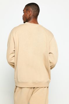 Cool down, warm up, or lounge in a classic Crew Neck made from midweight gabardine fleece — a. k. a the softest thing to grace your skin in this lifetime. This relaxed closet essential brings a put-together vibe and top-tier comfort few sweatshirts achieve. World's most elite fleece Pre-washed for a worn-in feel Pre-shrunk = consistent oversized fit Elite durability and sturdiness Must-have, any-season layer | Sg Emblem Men's Classic Crew in Sandstone Classic Relaxed Fit Sweats For Winter, Closet Essentials, Spiritual Gangster, Top Tier, Your Skin, Lounge, Sweatshirts Hoodie, Crew Neck, Bring It On