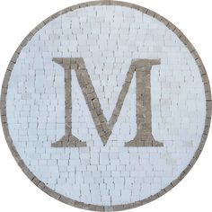 the letter m is made out of white and gray bricks with grey letters on it