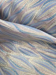 an up close shot of some metallic fabric