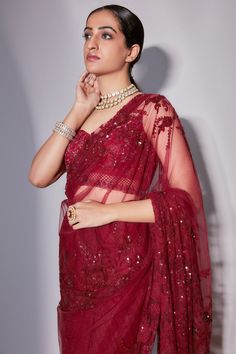 Maroon saree with floristry, sequin embroidery. Paired with blouse and petticoat.
Component: 3
Pattern: Embroidery
Type Of Work: Floristry, sequin
Neckline: Leaf neck
Sleeve Type: Sleeveless
Fabric: Tulle
Color: Maroon
Other Details: 
Jaal pattern on blouse
Sheer panelled pallu
Occasion: Reception - Aza Fashions Glamorous Pre-draped Saree With Resham Embroidery For Reception, Glamorous Dupatta With Resham Embroidery For Designer Wear, Glamorous Resham Embroidered Dupatta For Designer Wear, Glamorous Resham Embroidery Dupatta For Designer Wear, Glamorous Wedding Blouse With Dupatta, Glamorous Designer Dupatta With Unstitched Blouse, Glamorous Organza Blouse Piece For Festive Occasions, Glamorous Pre-draped Saree For Wedding And Navratri, Glamorous Festive Organza Blouse Piece