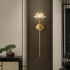 a wall mounted light in the shape of a flower on a wooden paneled door