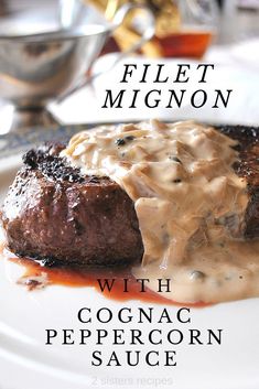 a plate with some meat covered in sauce on it and the title reads, filet migon with cognac peppercorn sauce