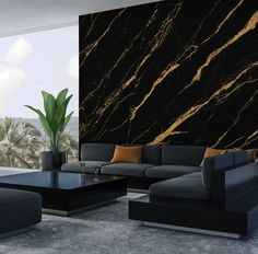 a modern living room with black and gold marbled walls, leather couches and coffee table