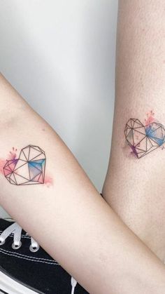 two tattoos on the legs of women