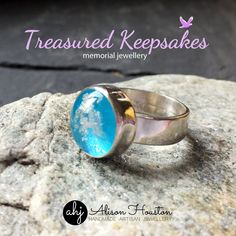 a ring sitting on top of a rock with the words, treasures keeps memorial jewelry