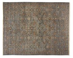 an antique rug with many different colors and patterns