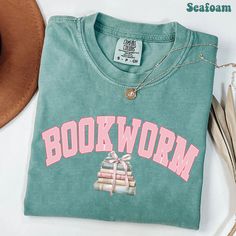 Bookworm Coquette Watercolor Comfort Colors Shirt, Coquette Book T-shirt, Reading Book Gift for Bookish, Book Lover Shirt, Librarian Tee * How To Order  1. Please, check and review all photos. 2. Choose your shirt style, size and color. 3. Click add to cart. You can go back to add more product. 4. Click "Proceed to check out". 5. When you check out, you can add a note to seller for any request. * Please check all Color, Size Charts and Shirt's Material in our product listing photos before placin Coquette Watercolor, Bookish Shirts, Bookish Clothing, Reading Tshirt, Sarcastic Clothing, Book Outfits, Bookworm Shirt, Shirt Coquette, Book Tshirts