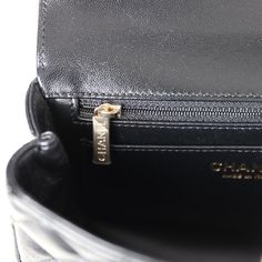 This Mini Rectangular flap bag is in black lambskin with light gold tone hardware and has a front flap with signature CC turnlock closure, rear half moon pocket, a faux crystal and black leather top handle and single interwoven black leather and light gold tone chain link shoulder/crossbody strap.The interior is lined in black leather and features a zipper pocket with Chanel pull and an open pocket below.Collection: 23A (RFID Chip)Origin: ItalyCondition: New and never worn (plastic on hardware)Accompanied by: Chanel box, Chanel dustbag, carebook, felt, RFID, retail UPC and ribbonMeasurements: 8" width x 5" height x 3" depth; 1.5" top handle, 20" strap drop Designer Top Handle Flap Bag With Cc Turnlock, Designer Top Handle Flap Bag With Cc Turnlock Closure, Designer Flap Shoulder Bag With Cc Turnlock Closure, Luxury Evening Flap Bag With Cc Turnlock Closure, Timeless Evening Flap Bag With Cc Turnlock Closure, Luxury Flap Bag With Cc Turnlock Closure For Travel, Classic Business Flap Bag With Cc Turnlock Closure, Timeless Rectangular Flap Bag With Cc Turnlock, Leather Flap Bag With Cc Turnlock For Evening